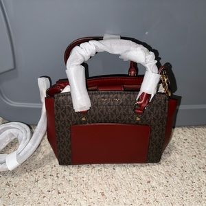 Michael Kors purse. Never used. Still in packaging.